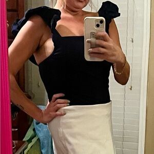 Large navy ruffled bodysuit from Pant’s Store. Button closure.